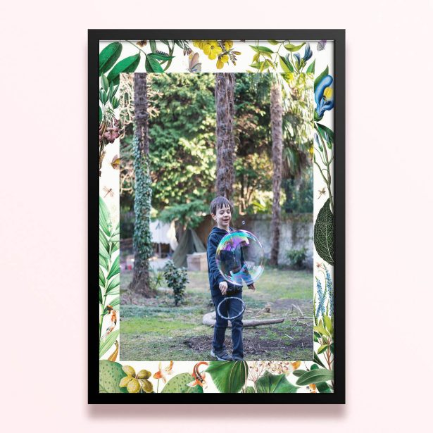 Simple framed print design with floral borders and one photo of a child playing outdoors