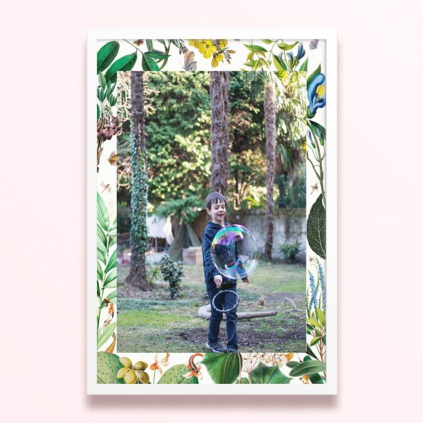 Simple framed print design with floral borders and one photo of a child playing outdoors