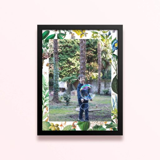 Simple framed print design with floral borders and one photo of a child playing outdoors