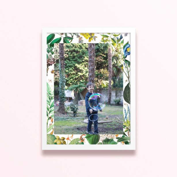 Simple framed print design with floral borders and one photo of a child playing outdoors