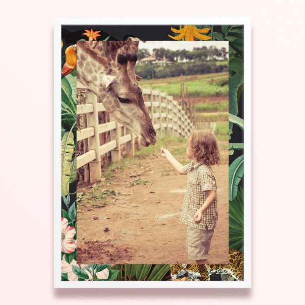 Simple framed prints design with one photo of a child feeding a giraffe, surrounded by a floral and jungle-themed border.