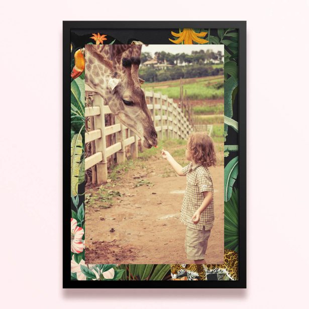 Simple framed prints design with one photo of a child feeding a giraffe, surrounded by a floral and jungle-themed border.