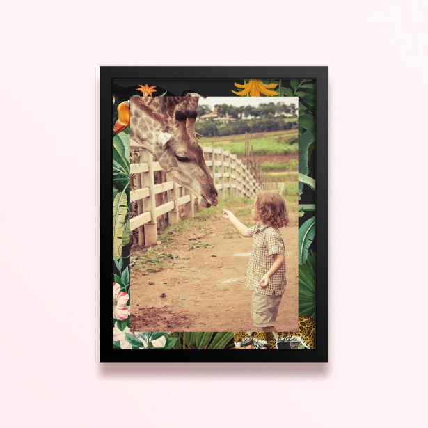 Simple framed prints design with one photo of a child feeding a giraffe, surrounded by a floral and jungle-themed border.