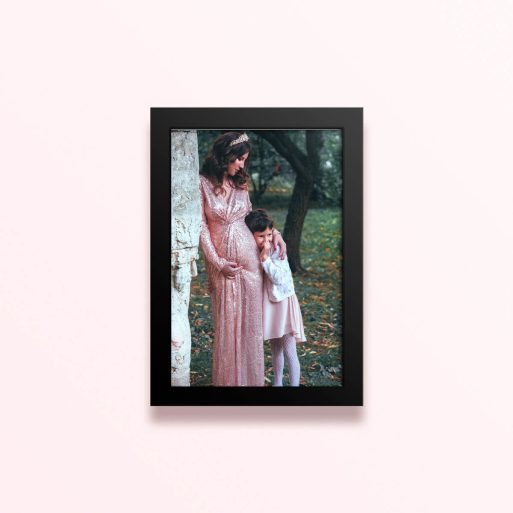 Simple framed prints designs featuring a woman in a long dress with crown and a child in a forest backdrop, one photo.