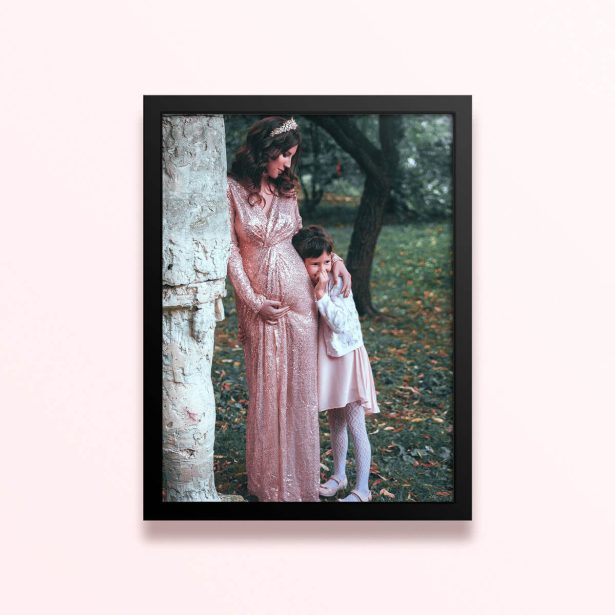 Simple framed prints designs featuring a woman in a long dress with crown and a child in a forest backdrop, one photo.