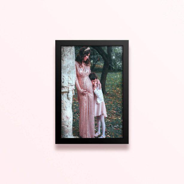 Simple framed prints designs featuring a woman in a long dress with crown and a child in a forest backdrop, one photo.