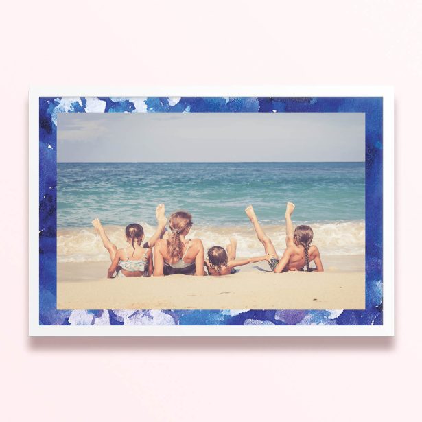 Simple framed prints designs with blue border and one photo of a family on the beach