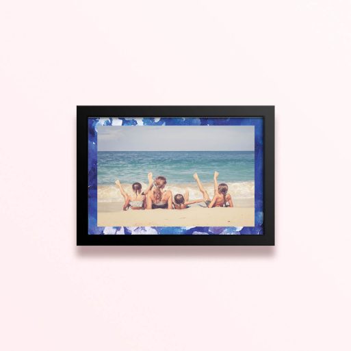 Simple framed prints designs with blue border and one photo of a family on the beach