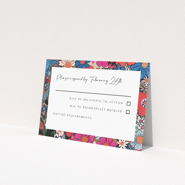 RSVP card template from the Soho Blossom suite, featuring vibrant floral design in deep pinks, blues, and purples, capturing the energetic spirit of Soho for couples seeking a lively and colourful celebration This is a view of the front