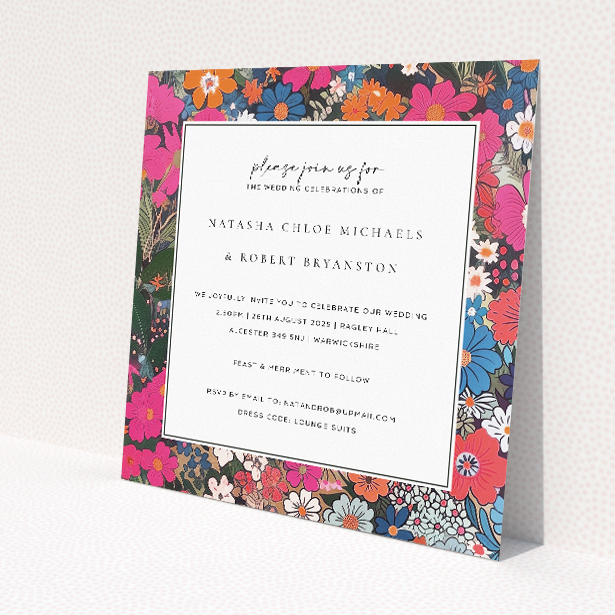 'Soho Blossom wedding invitation featuring vibrant floral abundance in deep pinks, blues, purples, and pops of orange against a white central panel, echoing the vivacious flair of Soho for a lively and colourful wedding celebration.'. This is a view of the front