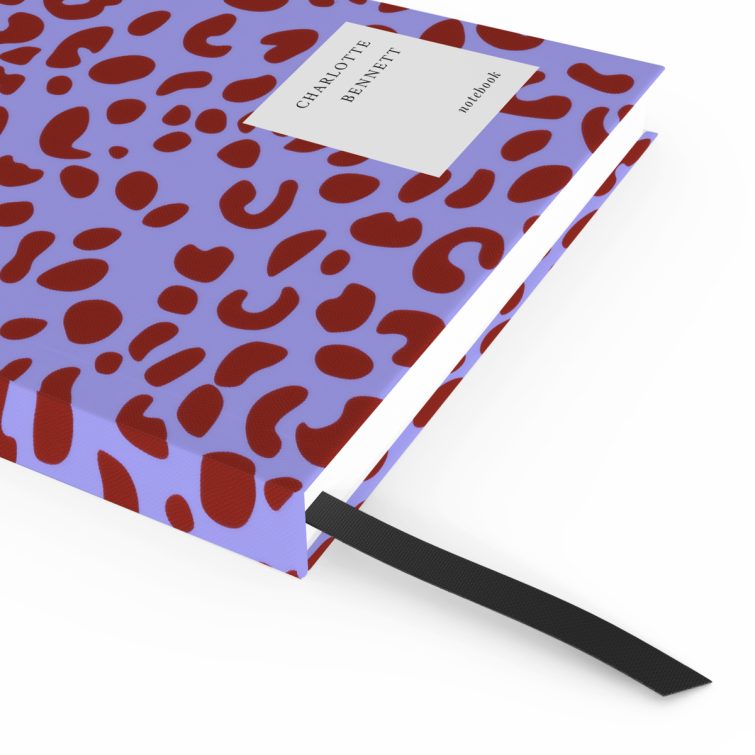 Colourful animal print notebook cover design with one photo placeholder featuring dummy content on the back.