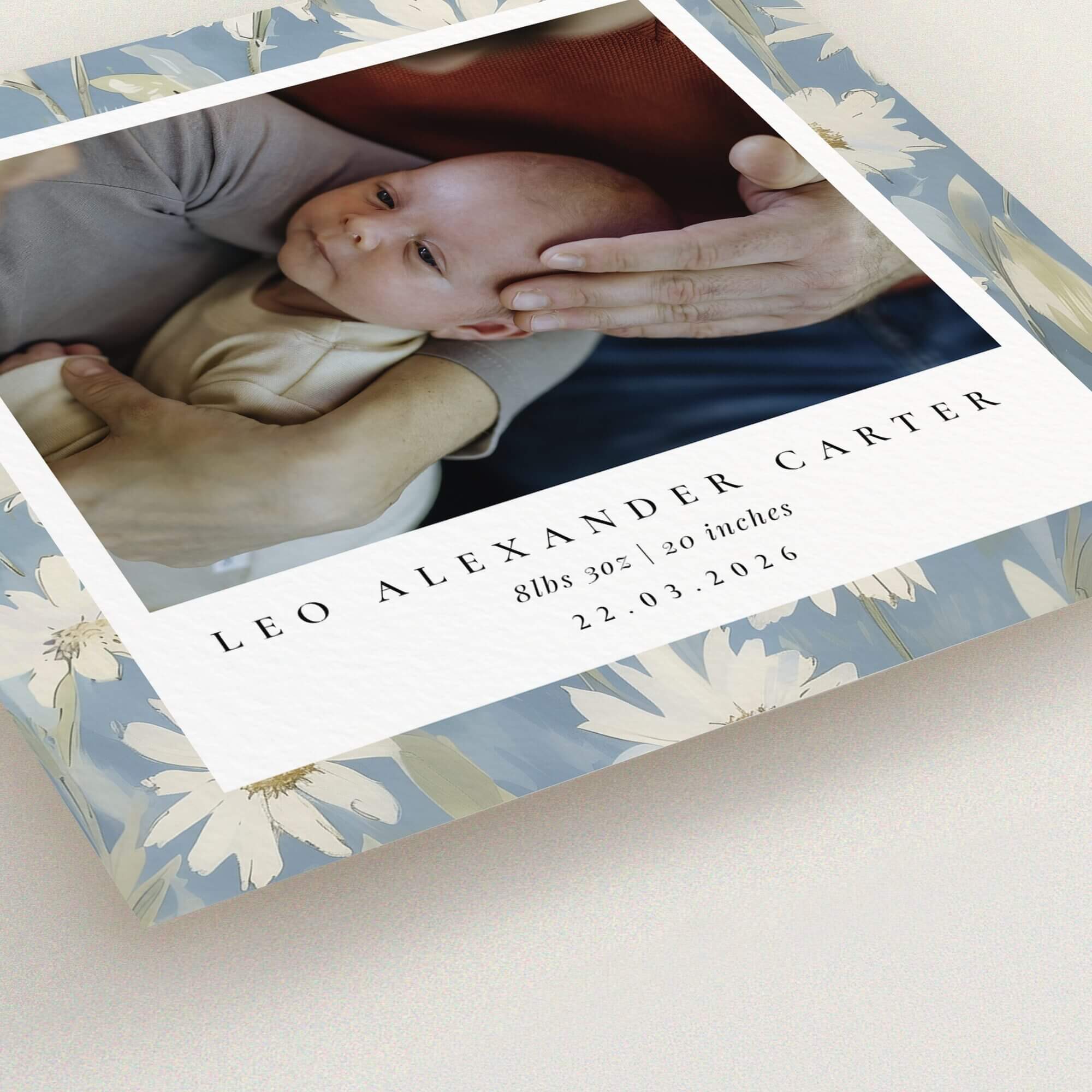 Floral themed birth announcement card with baby photo