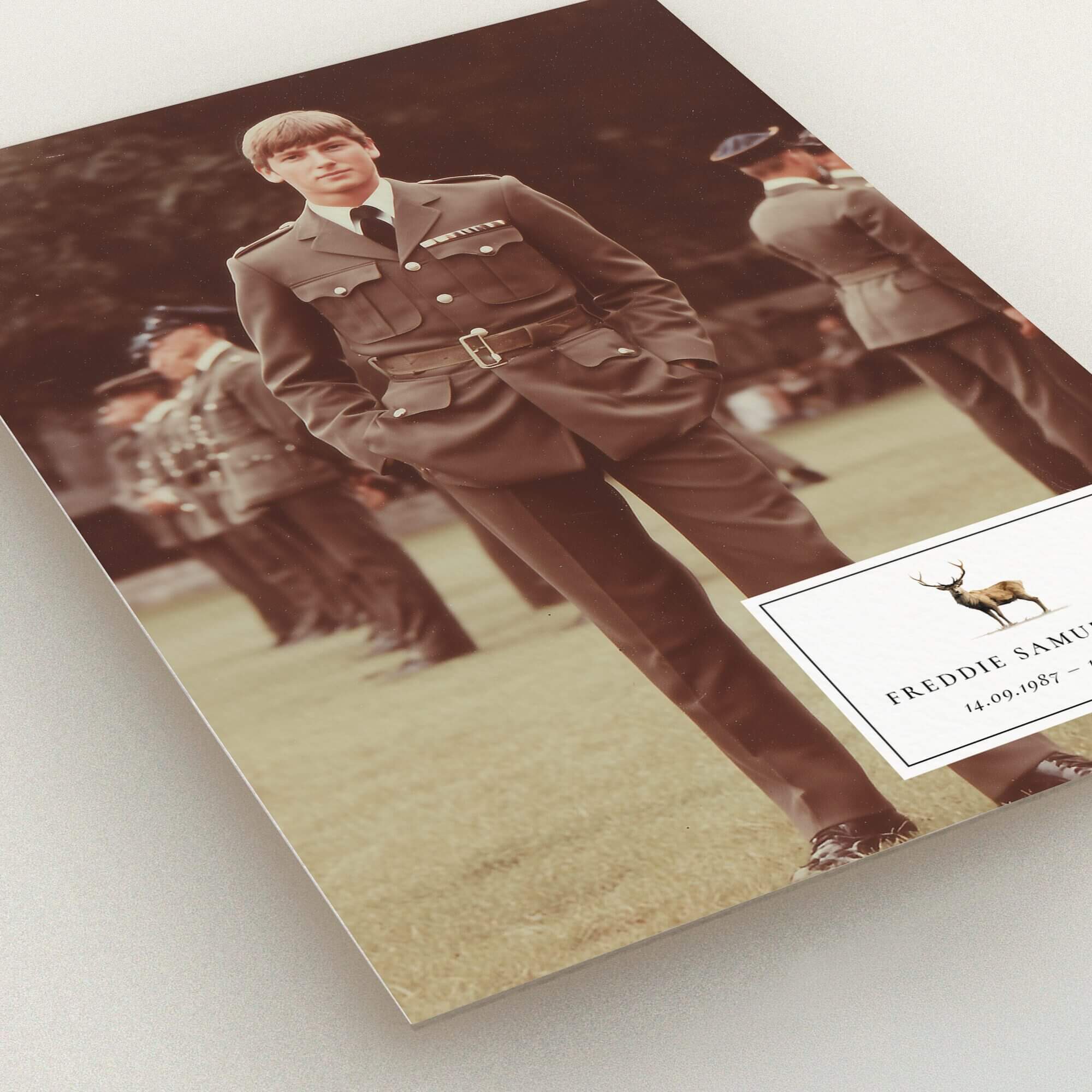 Funeral announcement design featuring a formal photograph with one image