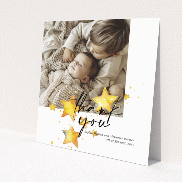 Baby thank you card with a single photo and star illustrations.