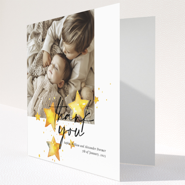 Baby thank you card with a single photo and star illustrations.