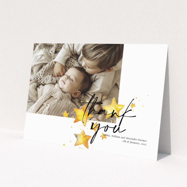 Baby thank you card with a single photo and star illustrations.