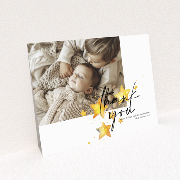 Baby thank you card with a single photo and star illustrations.
