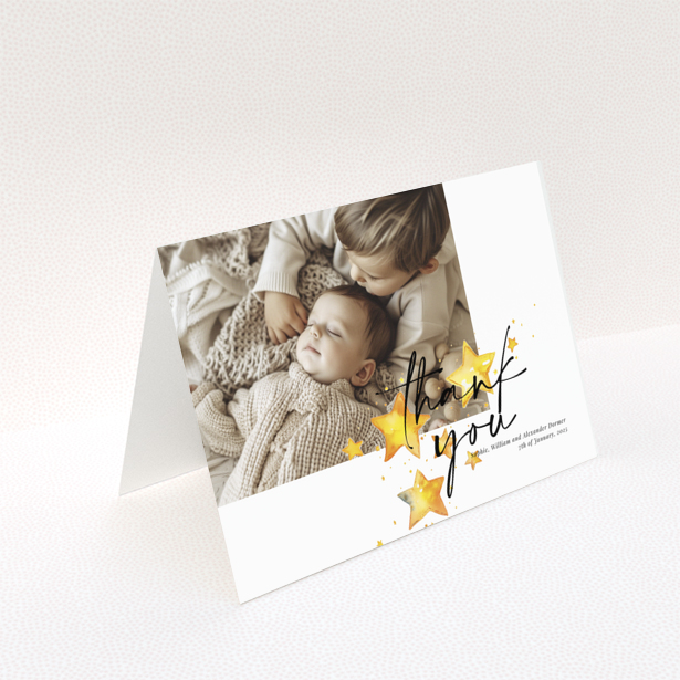 Baby thank you card with a single photo and star illustrations.