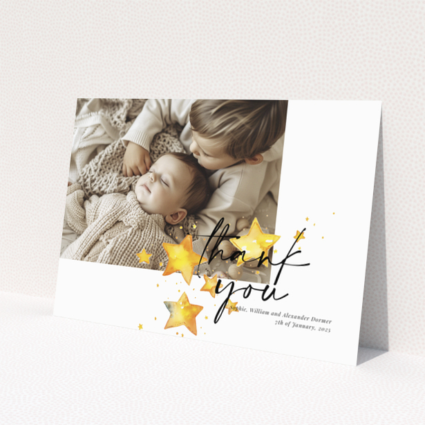 Baby thank you card with a single photo and star illustrations.