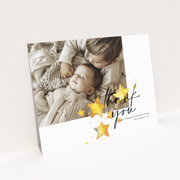 Baby thank you card with a single photo and star illustrations.