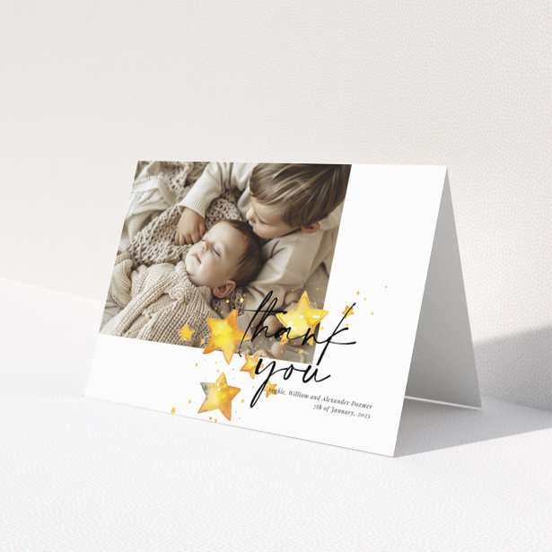 Baby thank you card with a single photo and star illustrations.