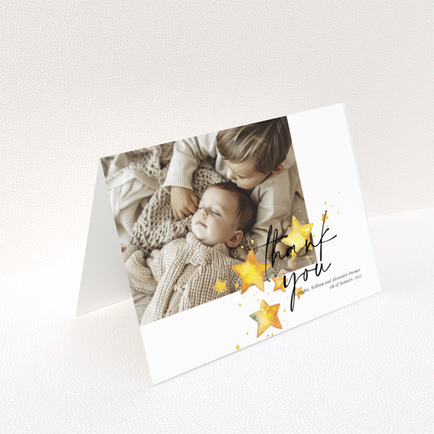 Baby thank you card with a single photo and star illustrations.