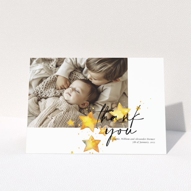 Baby thank you card with a single photo and star illustrations.