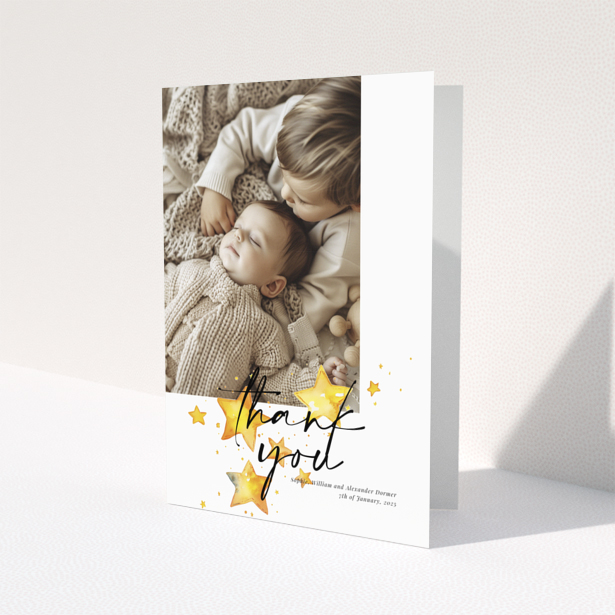 Baby thank you card with a single photo and star illustrations.