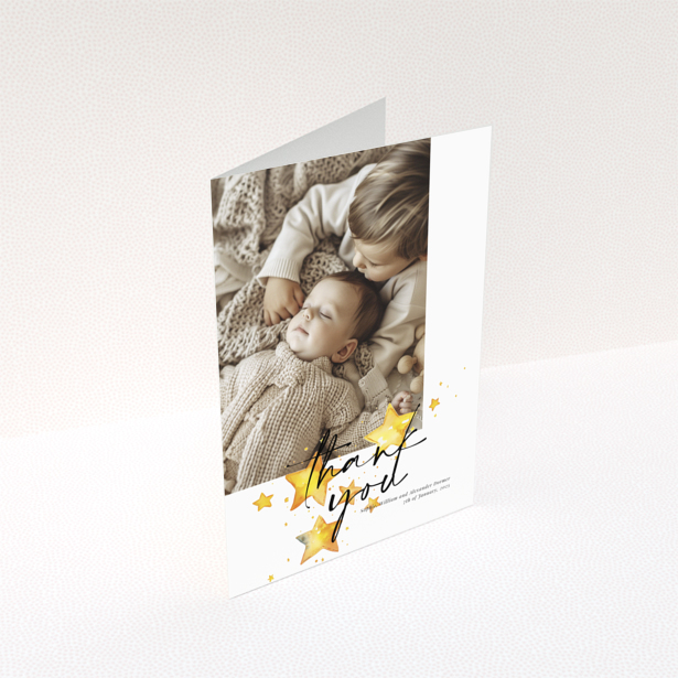 Baby thank you card with a single photo and star illustrations.