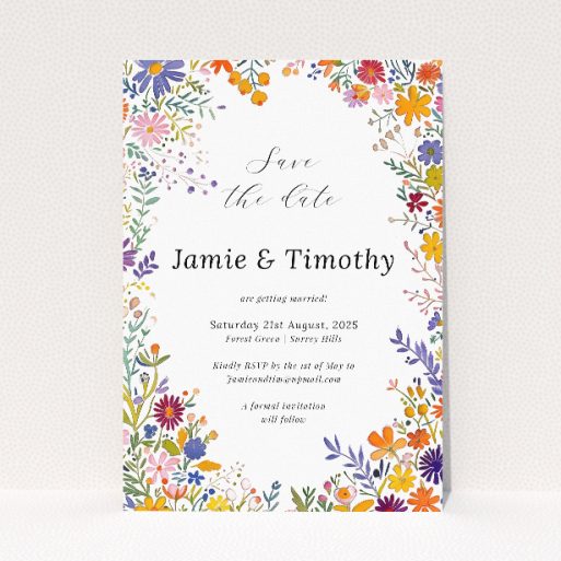 Summerfield Bloom Save the Date card - A6 portrait-oriented design with vibrant meadow flowers encircling a central white text area, evoking the essence of summer joy This is a view of the front
