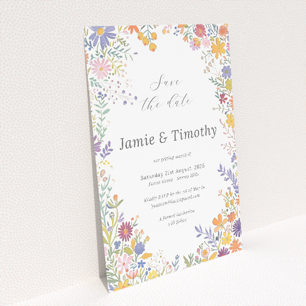 Summerfield Bloom Save the Date card - A6 portrait-oriented design with vibrant meadow flowers encircling a central white text area, evoking the essence of summer joy This is a view of the back