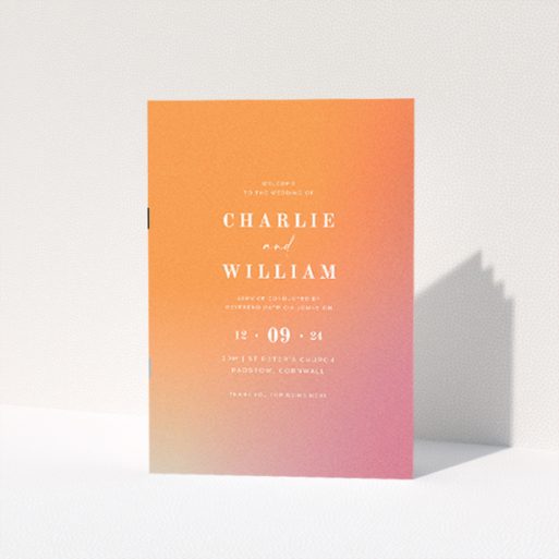 "Sundown Warmth wedding order of service booklet featuring gentle radiance of a setting sun with soft peach to soothing coral gradient, ideal for contemporary weddings and memorable keepsakes.". This is a view of the front