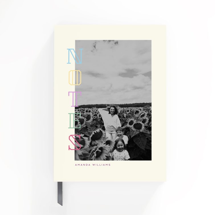 Modern black and white portrait notebook design with colourful text and one photo on the cover.