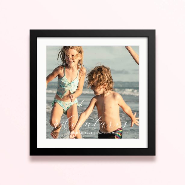 Framed and mounted photo print featuring children playing on the beach, capturing summer adventures in Cape Town.