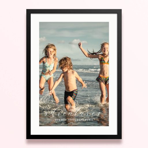 Framed and mounted photo print featuring children playing on the beach, capturing summer adventures in Cape Town.