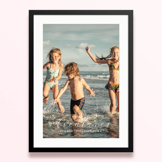 Framed and mounted photo print featuring children playing on the beach, capturing summer adventures in Cape Town.