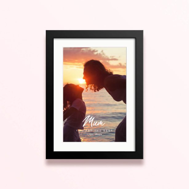 Framed and mounted photo print with one photo at sunset featuring silhouette of two people.