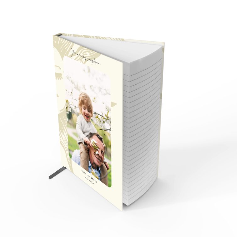 Notebook cover design with an illustrated sun and one photo on the front.