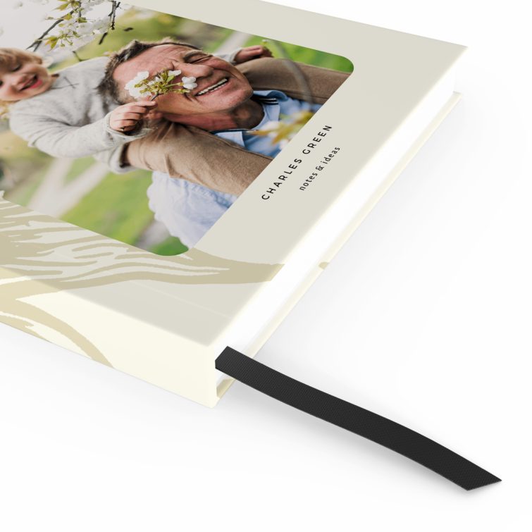 Notebook cover design with an illustrated sun and one photo on the front.