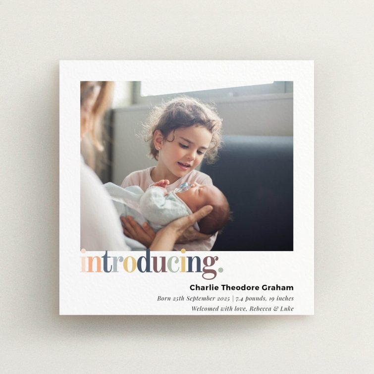 Colourful and modern birth announcement card design featuring one photo of a child meeting a newborn.