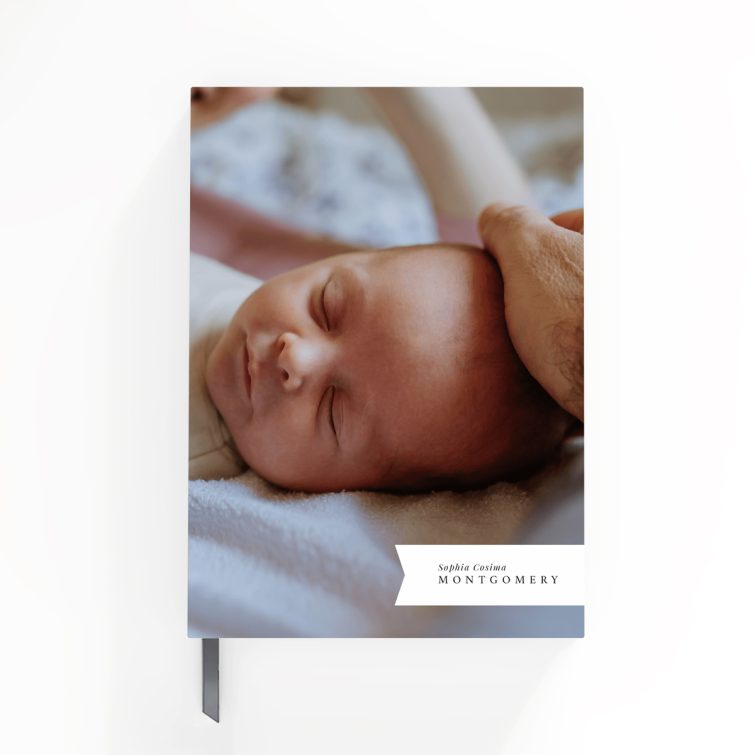 Personalised baby photo notebooks featuring four images, ideal for new parents.