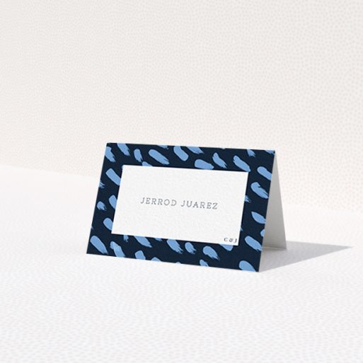 A table place card design titled 'Blue strokes'. It is an 85 x 55mm card in a landscape orientation. 'Blue strokes' is available as a folded card, with tones of blue and white.
