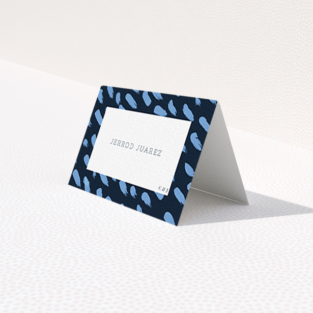A table place card design titled "Blue strokes". It is an 85 x 55mm card in a landscape orientation. "Blue strokes" is available as a folded card, with tones of blue and white.