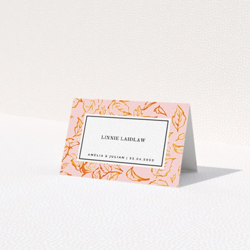 A table place card design called 'Falling Foliage'. It is an 85 x 55mm card in a landscape orientation. 'Falling Foliage' is available as a folded card, with tones of pink and orange.