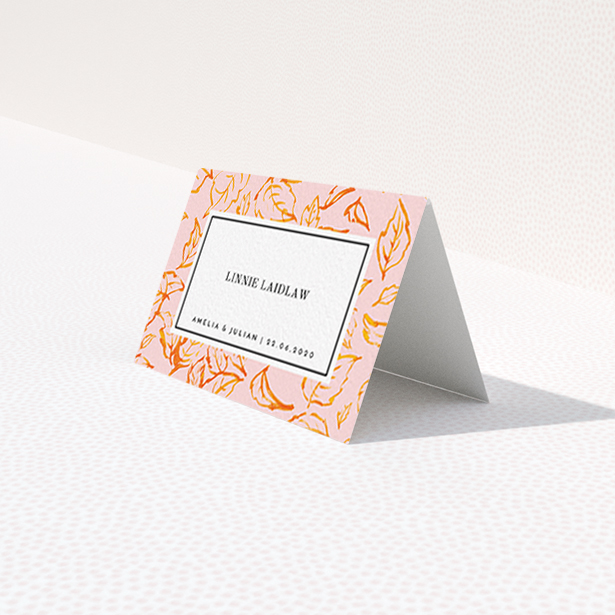 A table place card design called "Falling Foliage". It is an 85 x 55mm card in a landscape orientation. "Falling Foliage" is available as a folded card, with tones of pink and orange.