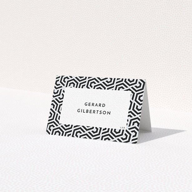 A table place card design titled 'Geometric corners'. It is an 85 x 55mm card in a landscape orientation. 'Geometric corners' is available as a folded card, with tones of navy blue and white.