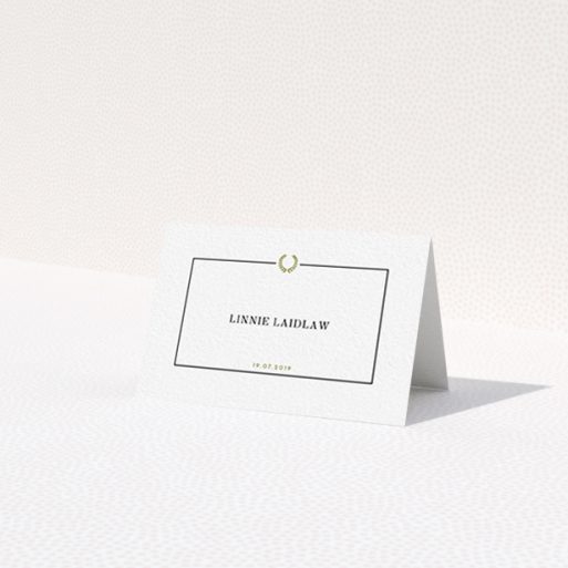 A table place card design named 'Greco Border'. It is an 85 x 55mm card in a landscape orientation. 'Greco Border' is available as a folded card, with tones of gold and white.