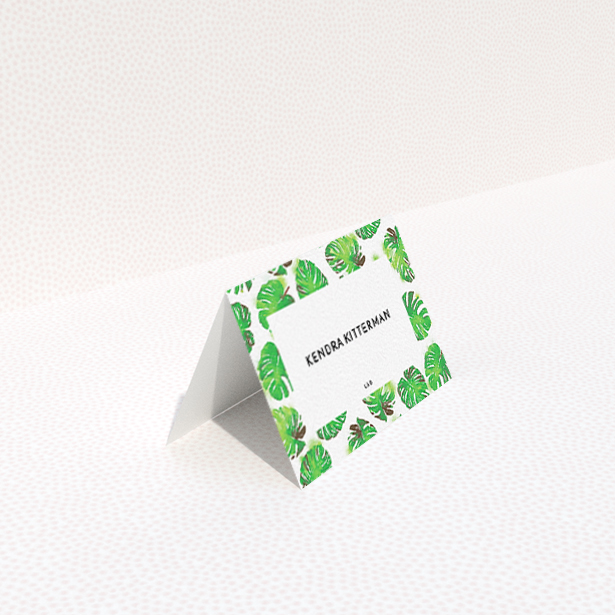A table place card design named "Jungle Sky". It is an 85 x 55mm card in a landscape orientation. "Jungle Sky" is available as a folded card, with tones of green and white.