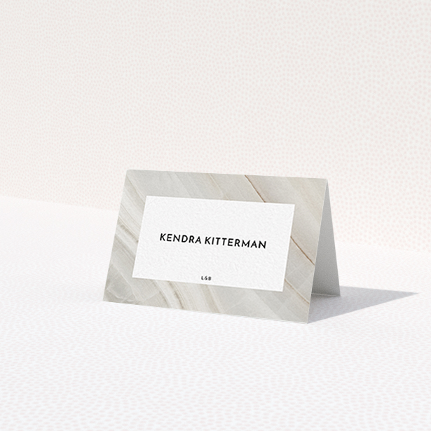 A table place card design titled 'Marble Swerve'. It is an 85 x 55mm card in a landscape orientation. 'Marble Swerve' is available as a folded card, with tones of grey and white.