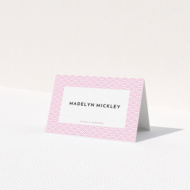 A table place card called "Pink Fans". It is an 85 x 55mm card in a landscape orientation. "Pink Fans" is available as a folded card, with tones of pink and white.